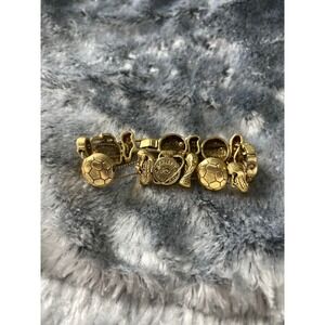 vintage gold-toned soccer-themed slide charm bracelet, likely by the brand TOFA